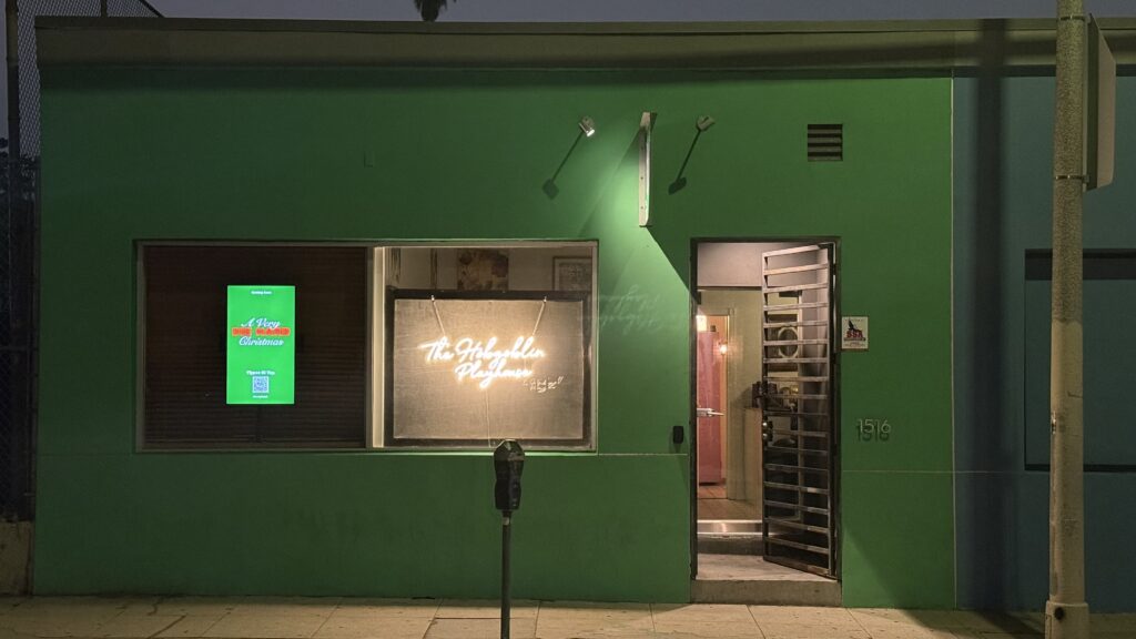 Ad space on a vibrant green storefront for advertising opportunities.